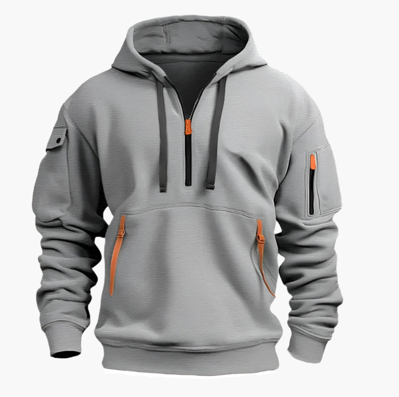 Sportlicher Herren-Kapuzenpullover mit Half-Zip, Utility-Style & praktischen Reißverschlusstaschen für Sportmode.