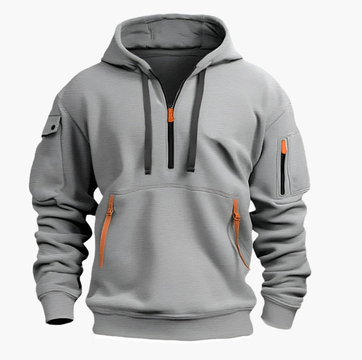 Sportlicher Herren-Kapuzenpullover mit Half-Zip, Utility-Style & praktischen Reißverschlusstaschen für Sportmode.