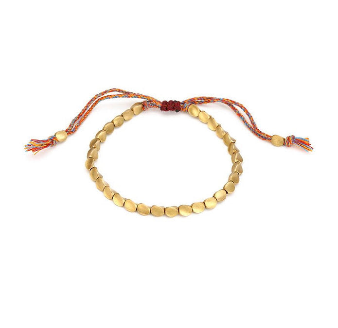 Geflochtenes Kupferarmband unisex mit spirituellen Kupferperlen, ein stilvolles Schmuckstück und Accessoire.