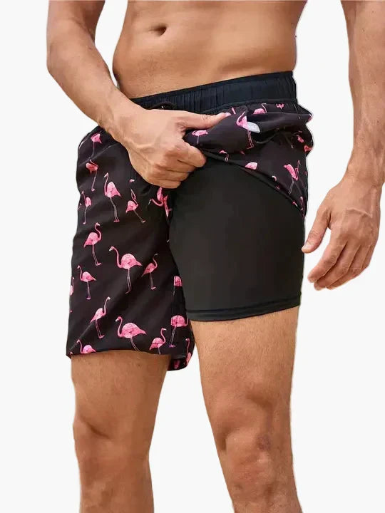 Herren Badeshorts mit Kompressionsshorts, schnelltrocknend, tropisches Design, ideal für Sport & Schwimmen.