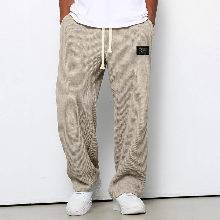 Modische Casualhose für Herren: Weite Beine, verstellbarer Bund. Eine bequeme und funktionale Streetwear-Hose.