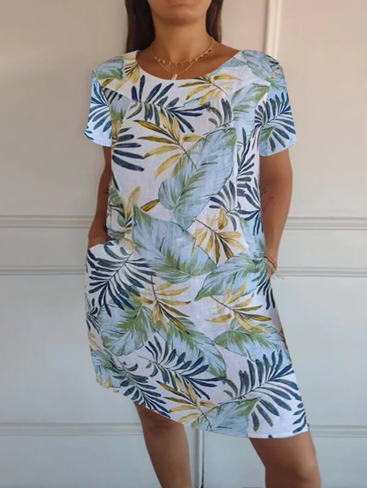 Damen Frühling-/Sommerkleid mit botanischem Print, Rundhals, bequemem Schnitt und praktischen Taschen.