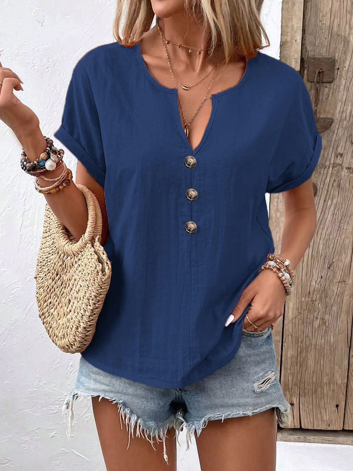 Aprikosenfarbenes Damen T-Shirt mit elegantem Twist-Knopf-Detail, kurzärmlig, perfekt für Sommer & Freizeit.