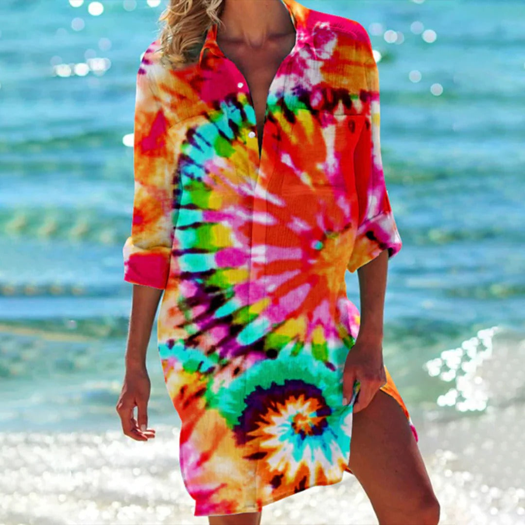 Seitliche Ansicht des tropischen Damen Strandkleids, leicht, luftig und mit buntem Aquarellmuster.