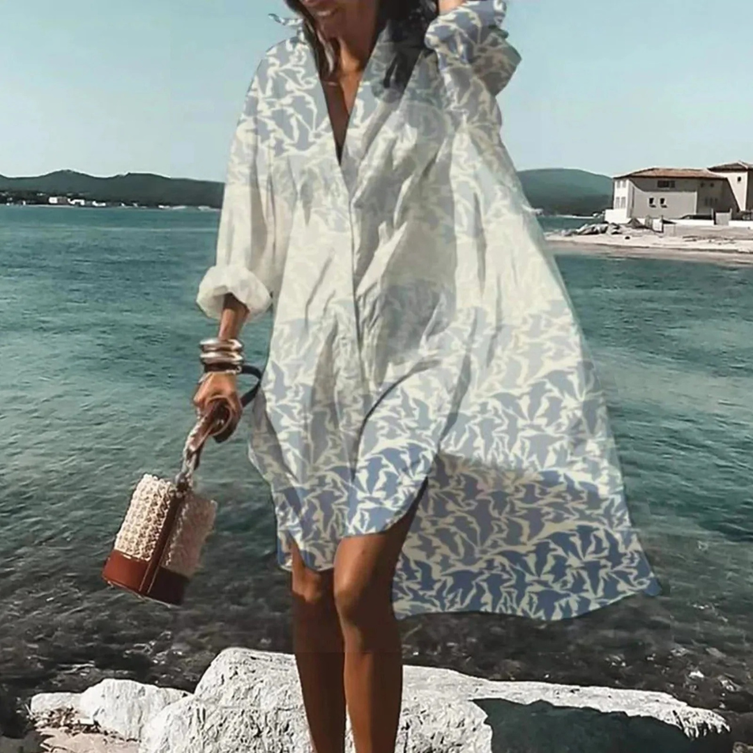 Locker fallendes Damen Sommer Midikleid mit elegantem Print, ideal als Freizeit- & Urlaubskleid.