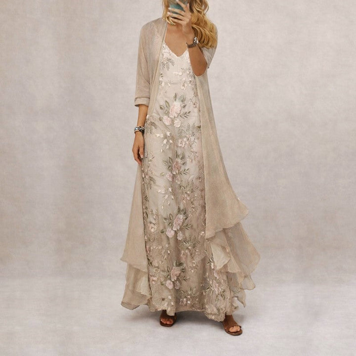 Blaues Damen Maxikleid mit floralem Muster. Ärmelloses Freizeitkleid, elegant und bequem für sommerliche Anlässe.