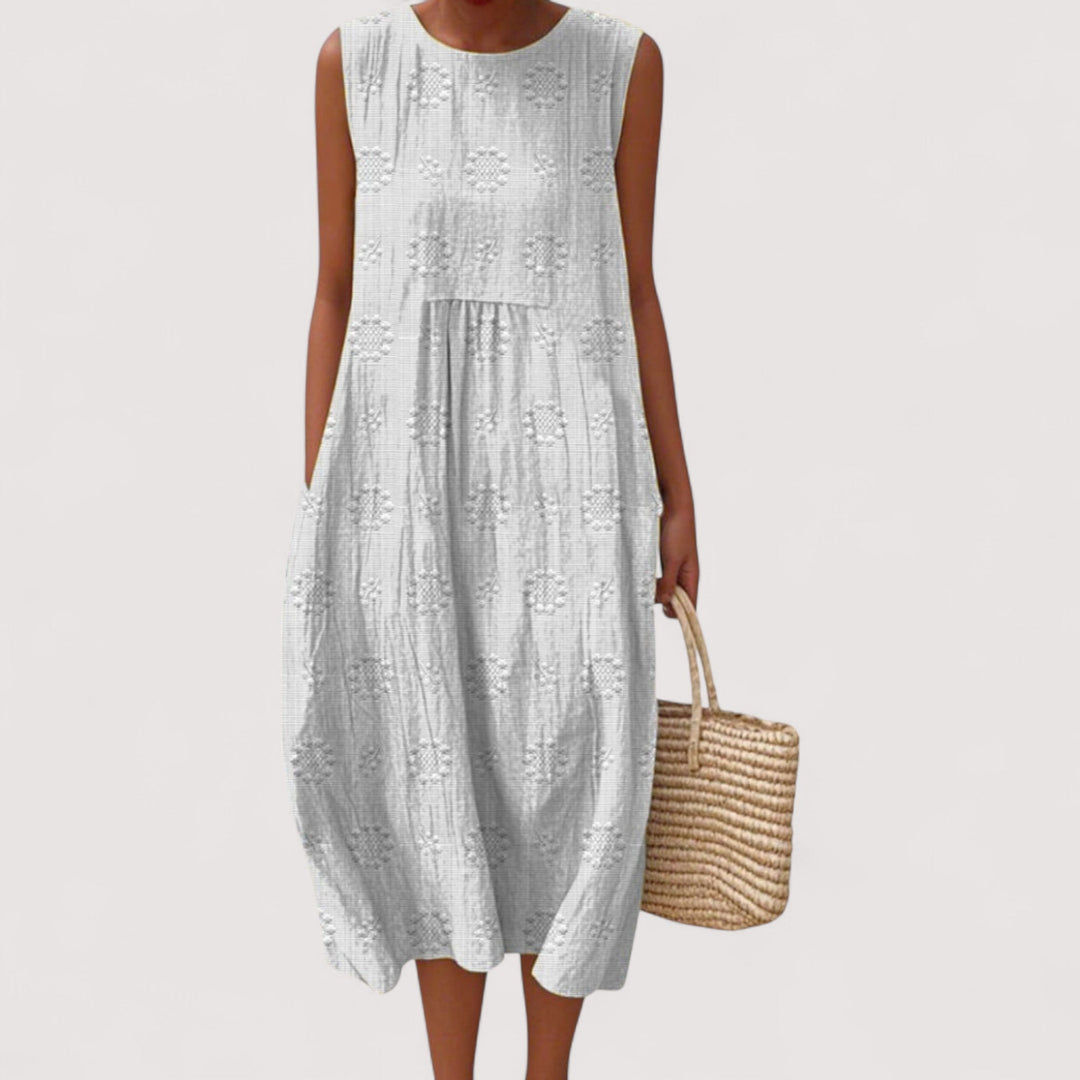 Stilvolles ärmelloses Sommerkleid für Damen mit floralem Design, leicht, komfortabel und elegant.