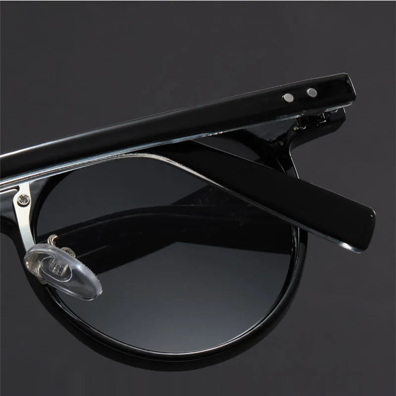 Leichte runde Herren Sonnenbrille im Retro-Design mit polarisierten UV-Schutzgläsern, komfortables Modeaccessoire.