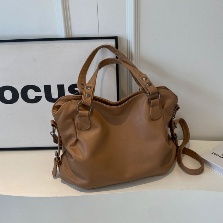 Braune große Damen Handtasche. Geräumige Schultertasche mit verstellbarem Gurt, perfekt für Einkäufe.