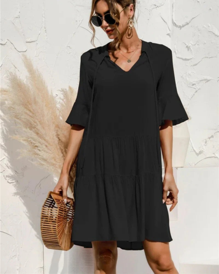 Trendiges Damen Midi-Sommerkleid mit auffälligem Blumenmuster, Puffärmeln & Rundhalsausschnitt.