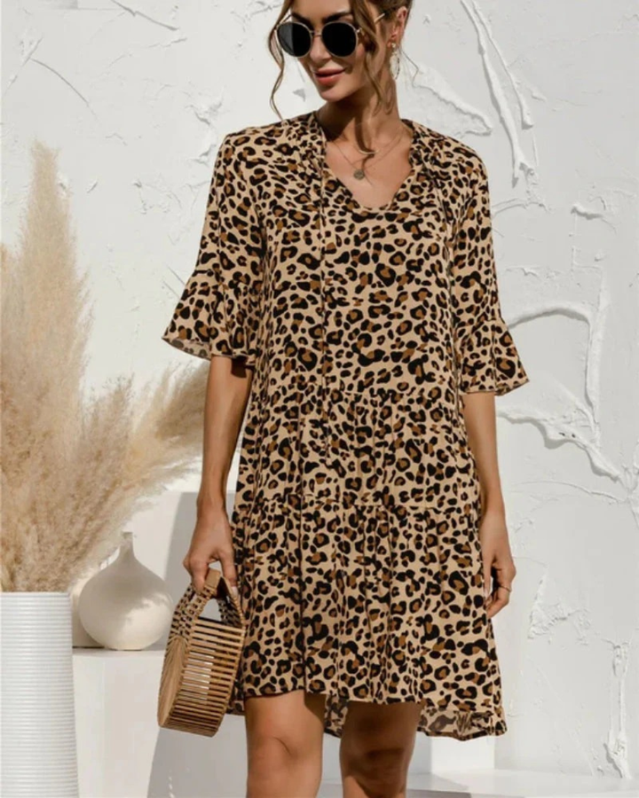 Luftiges Damen Urlaubskleid mit Blumenprint, Puffärmeln & Midi-Länge für entspannte Sommertage.