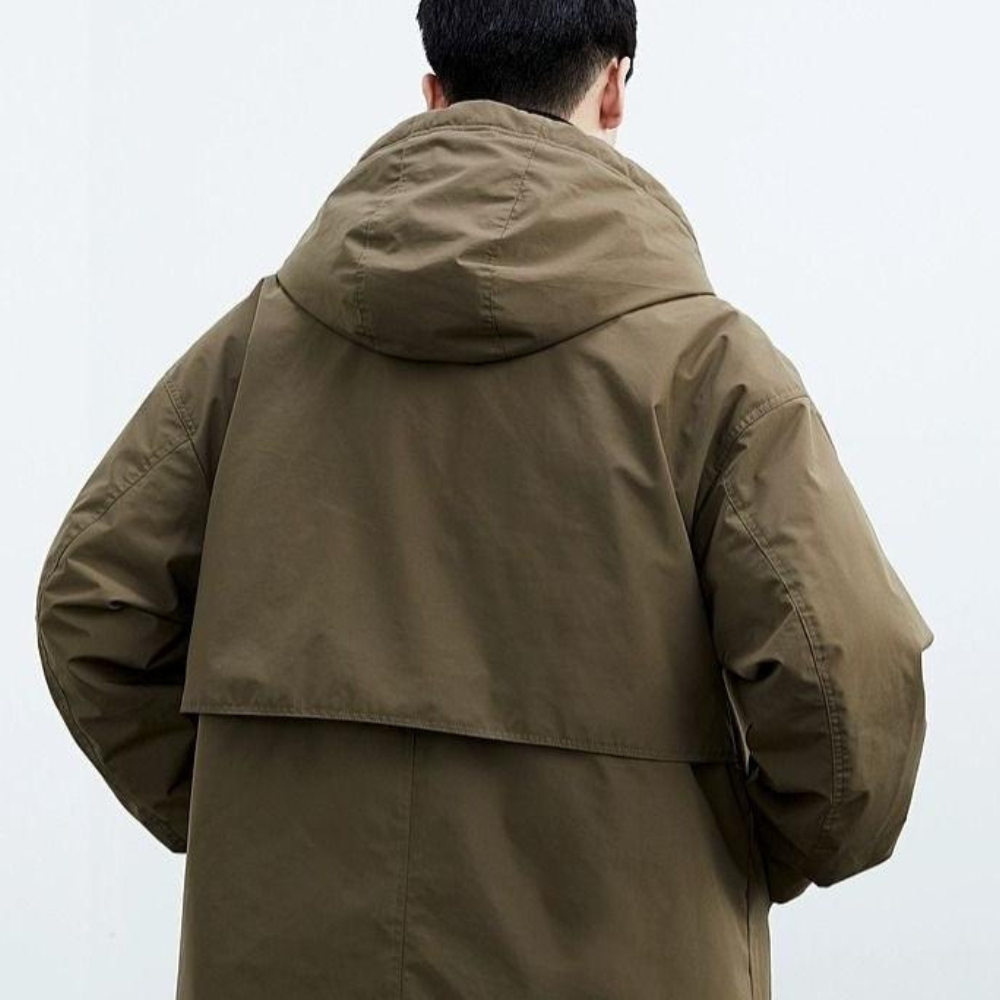 Stilvolle grüne Damen- & Herren-Kapuzenjacke, wasserdicht und atmungsaktiv; ideal für Sport und Freizeit.